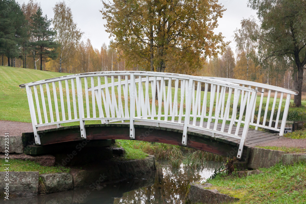 White bridge and pond in the city park Haanoja. Kouvola, Finland White bridge and pond in the city park Haanoja. Kouvola, Finland