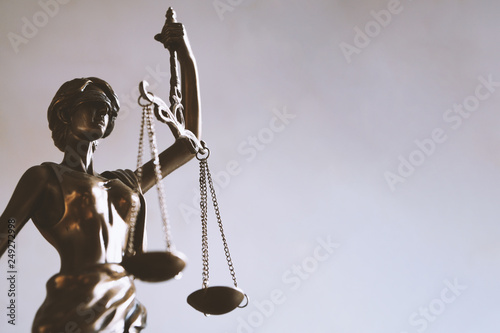 Fototapeta lady justice or justitia - blindfolded figurine holding balance scales - law jur
