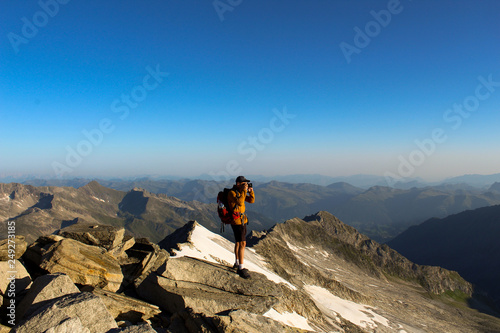 Male model on a rock at the Kesskogel summit in Hohe Tauern national park