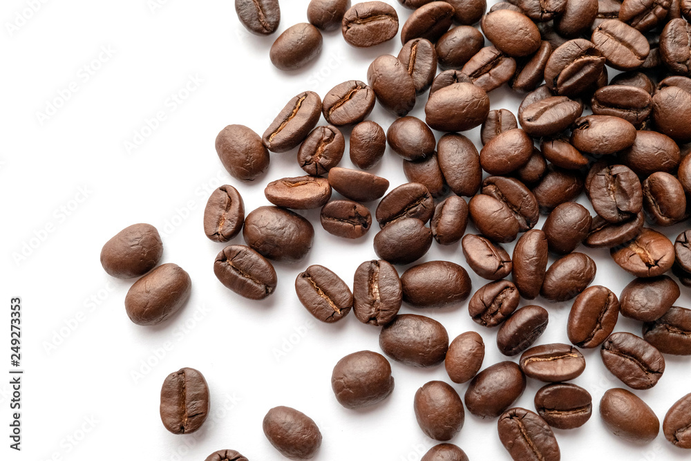Roasted coffee beans isolated on white background. Close-up. Roasted coffee beans isolated on white background. Close-up.