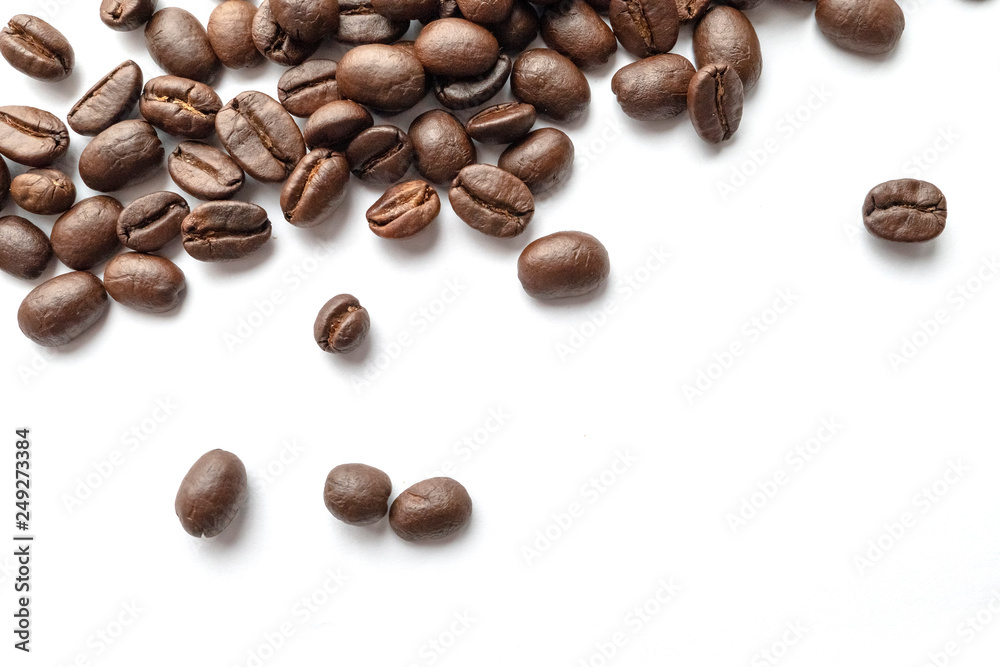 Roasted coffee beans isolated on white background. Close-up. Roasted coffee beans isolated on white background. Close-up.