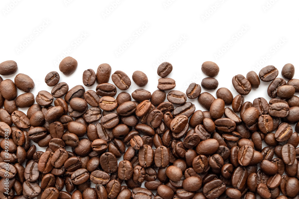 Roasted coffee beans isolated on white background. Close-up. Roasted coffee beans isolated on white background. Close-up.