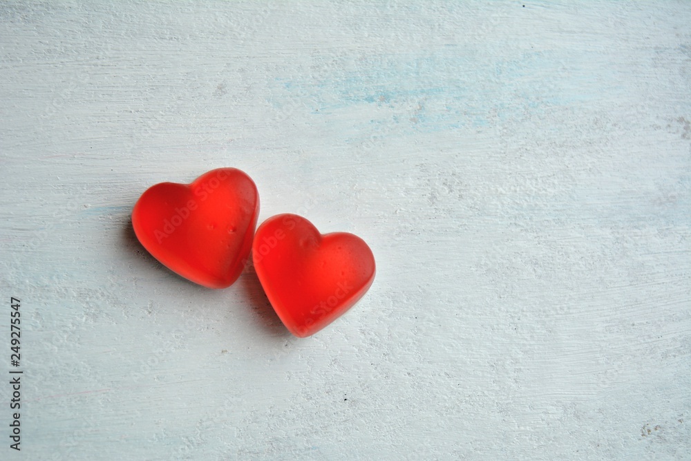 Two red hearts valentine's sweets top view white background