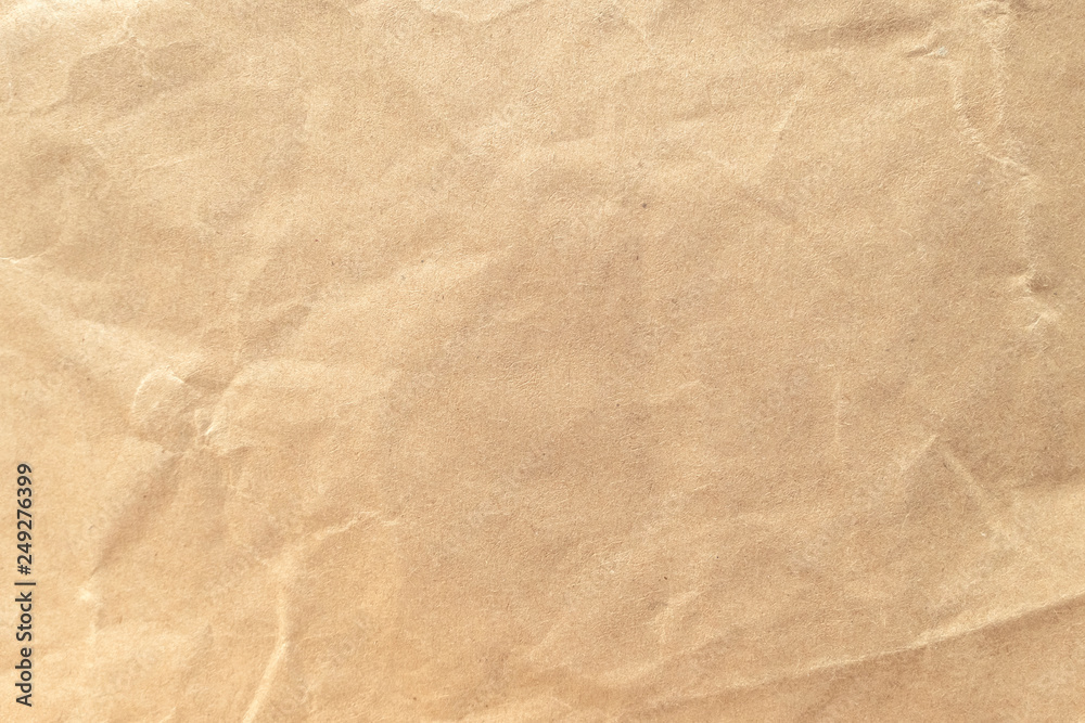 Fototapeta premium Brown crumpled paper texture background.