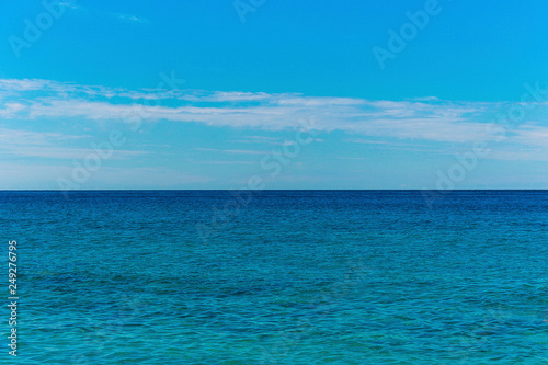 Seascape with sea horizon and cloudy sky - background