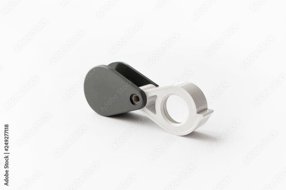 Magnifying glass for diamonds or see the amulet Isolated on a White Background.