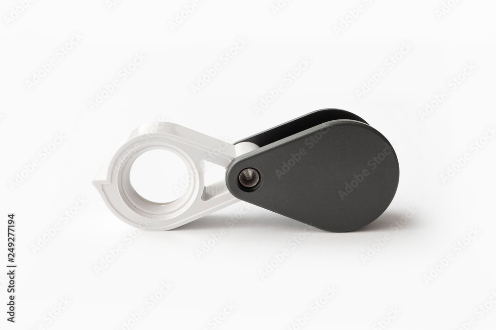 Magnifying glass for diamonds or see the amulet Isolated on a White Background. Magnifying glass for diamonds or see the amulet Isolated on a White Background.