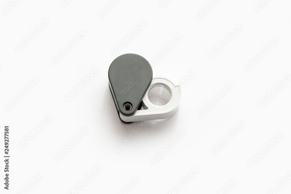 Magnifying glass for diamonds or see the amulet Isolated on a White Background.