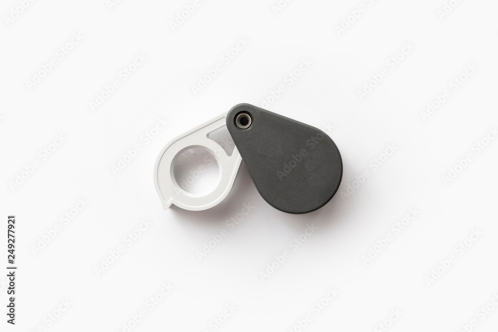 Magnifying glass for diamonds or see the amulet Isolated on a White Background. Magnifying glass for diamonds or see the amulet Isolated on a White Background.