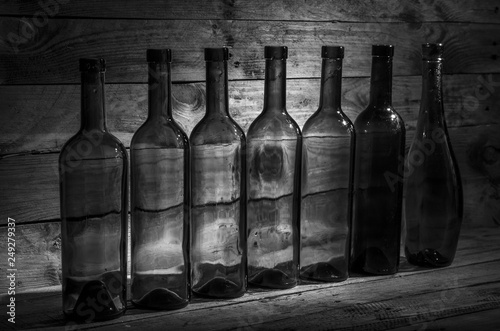 Old wine bottles in the dark.