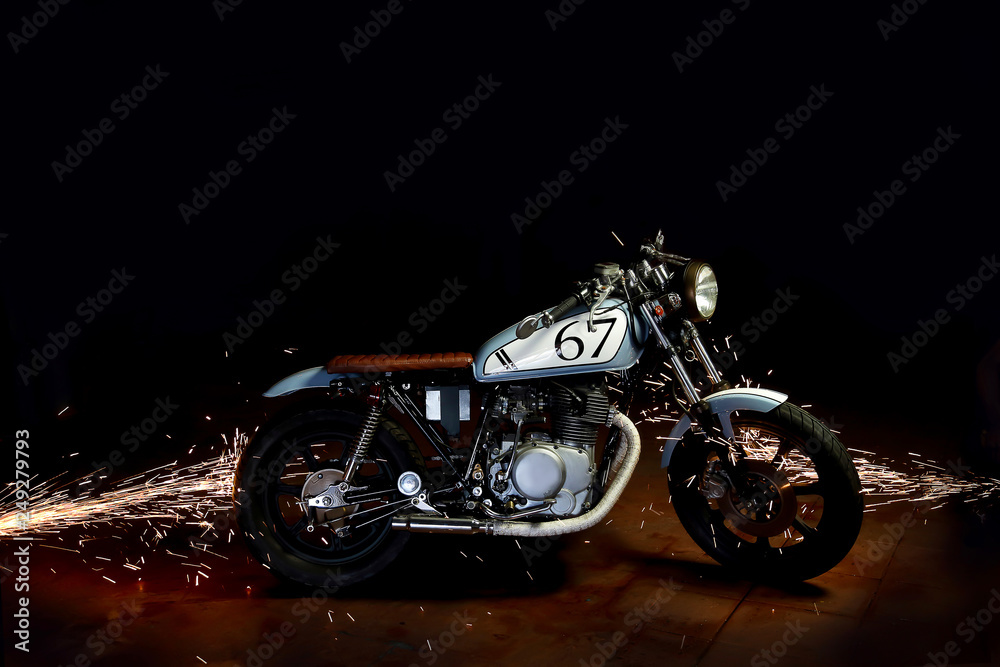 cafe racer motor cycle with grinding sparks