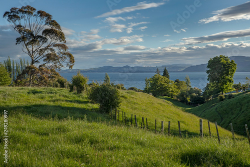Hamurana Lake Rotorua New Zealand. Country side hills photo