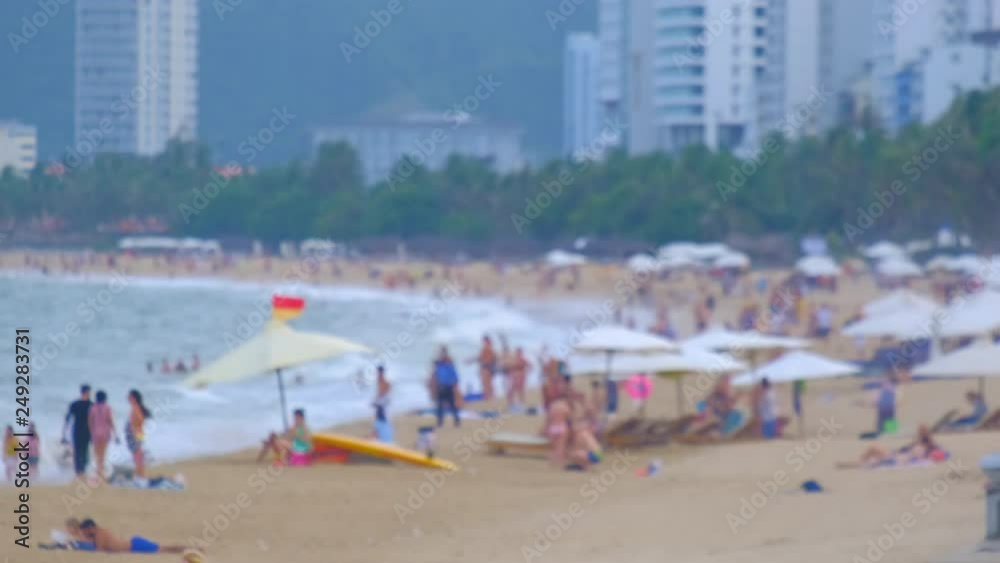Blur, blurry, defocus panoramic view sand beach. Crowd people travel, tourists relax on the coastline. Nha Trang is the most popular destinations in Vietnam. Summer holiday vacation background blurred Blur, blurry, defocus panoramic view sand beach. Crowd people travel, tourists relax on the coastline. Nha Trang is the most popular destinations in Vietnam. Summer holiday vacation background blurred
