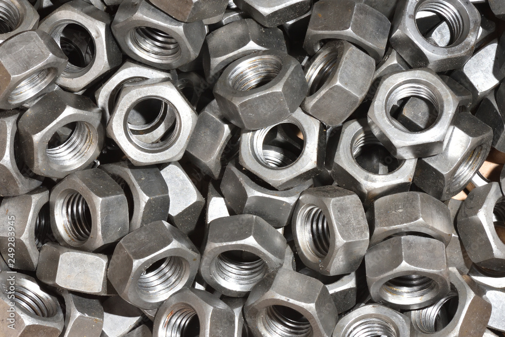 Texture of many metal nuts for product assembly at the factory Texture of many metal nuts for product assembly at the factory