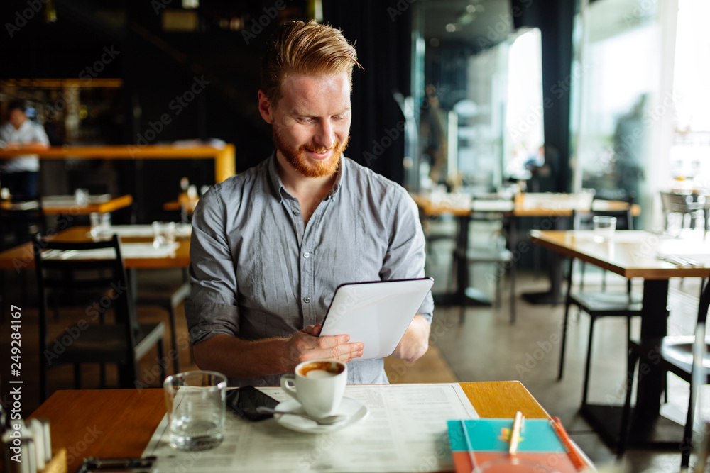 Handsome smart businessman constantly busy and working Handsome smart businessman constantly busy and working