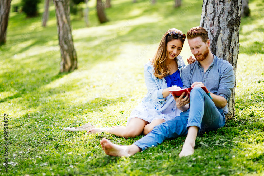 Lovely university students studying outdoors Lovely university students studying outdoors