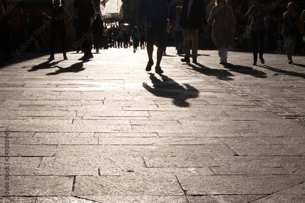 Silhouettes of tourists and shoppers in Malta