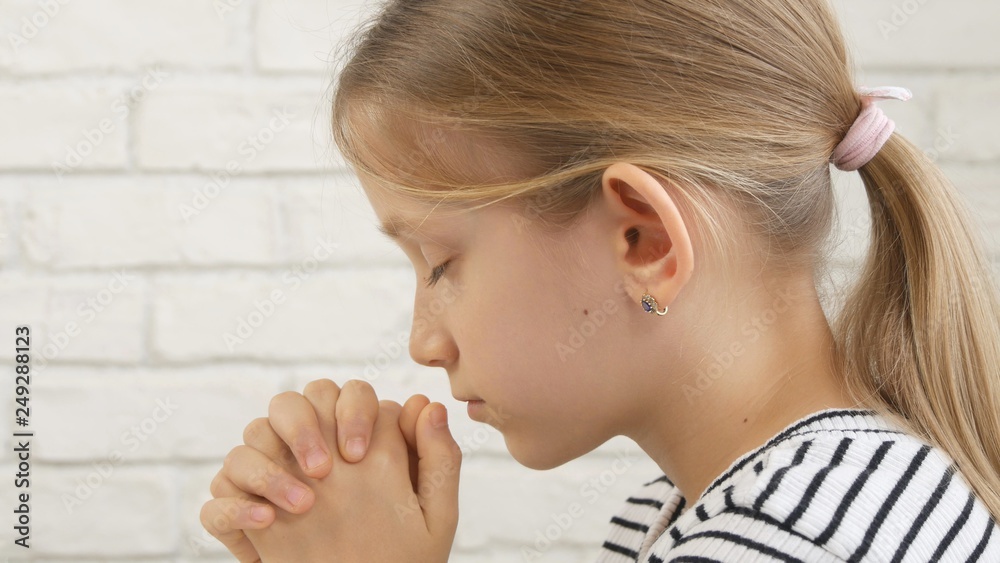 Child Face Praying Before Eating, Kid in Kitchen, Girl Portrait Meditating Child Face Praying Before Eating, Kid in Kitchen, Girl Portrait Meditating
