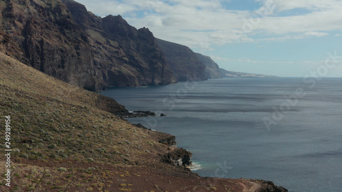 Aerial survey above the Atlantic Ocean in Tenerife, Canary islands, the rocks Los Gigantos