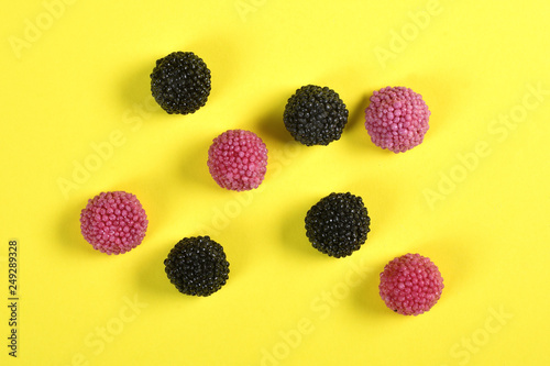 group of Blackberry  jelly candy on yellow background