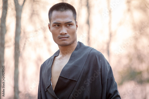 Portrait of men wearing samurai suits,Asian samurai man with Natural background,A man with a solemn face