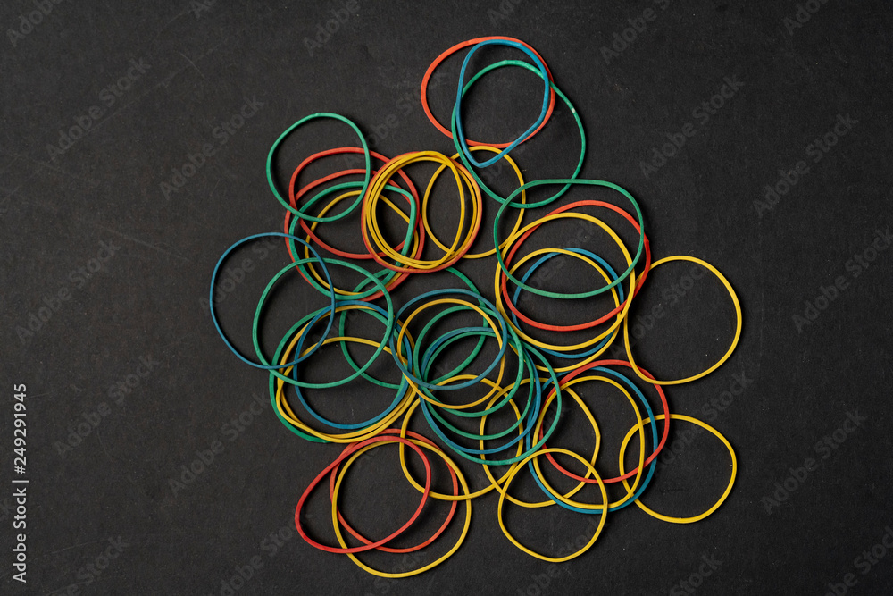 top view flat lay of colorful cash money rubber on dark surface top view flat lay of colorful cash money rubber on dark surface