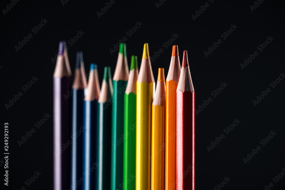 selective focus of sharpened multicolor pencils isolated on black, lgbt concept selective focus of sharpened multicolor pencils isolated on black, lgbt concept