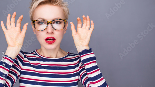 Beauty portrait of a young caucasian healthy woman holding glasses and looking at camera. Wow  I don t believe you 