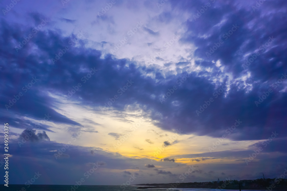 Beautiful sunset and sky with clouds over the Indian Ocean. Kanyakumari, India