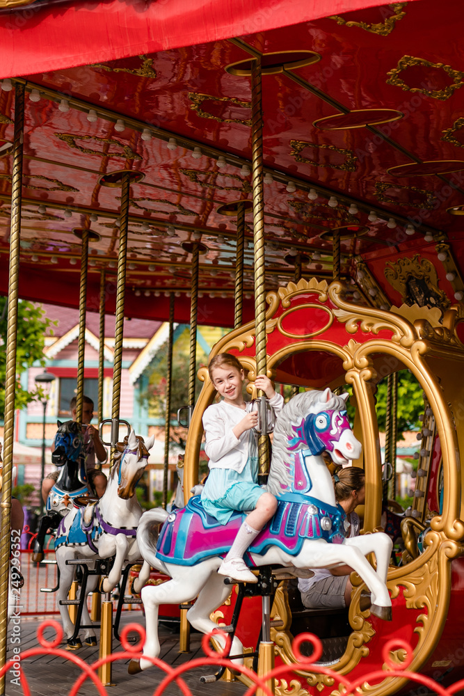 Blonde girl and ginger boy in the enterteiment park. RUSSIA, SOCHI, Sochi-park, june 2018