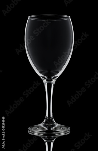 one crystal wine glass on a black background white contours