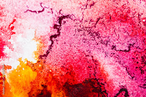top view of pink, white and orange watercolor spills with copy space