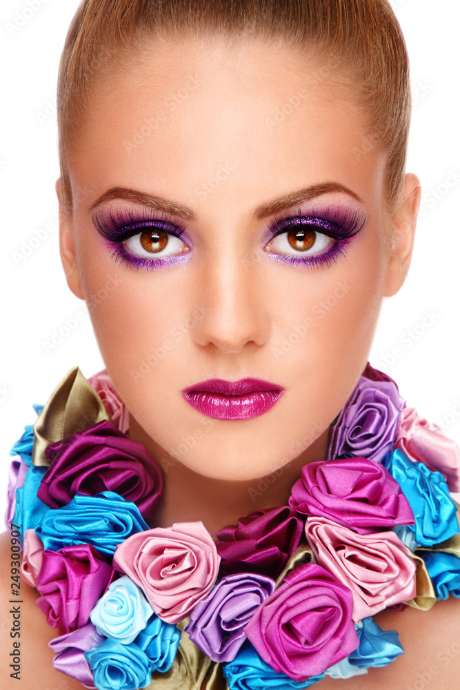 Portrait of young beautiful girl with fancy violet make-up and necklace of silk roses Portrait of young beautiful girl with fancy violet make-up and necklace of silk roses