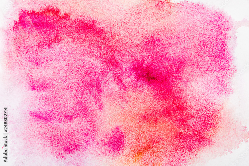 top view of pink watercolor spill on white paper top view of pink watercolor spill on white paper