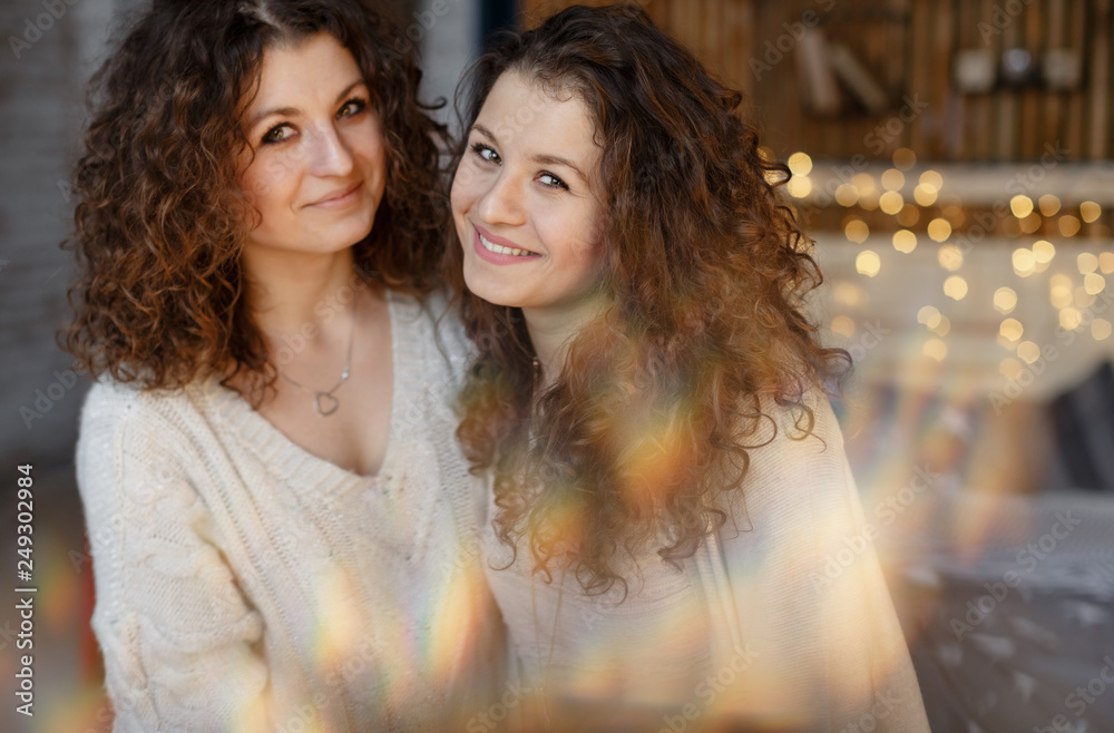Fototapeta premium two beautiful curly twins smile