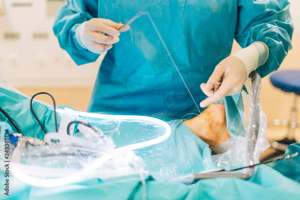 Team of surgeons operating in the hospital Team of surgeons operating in the hospital