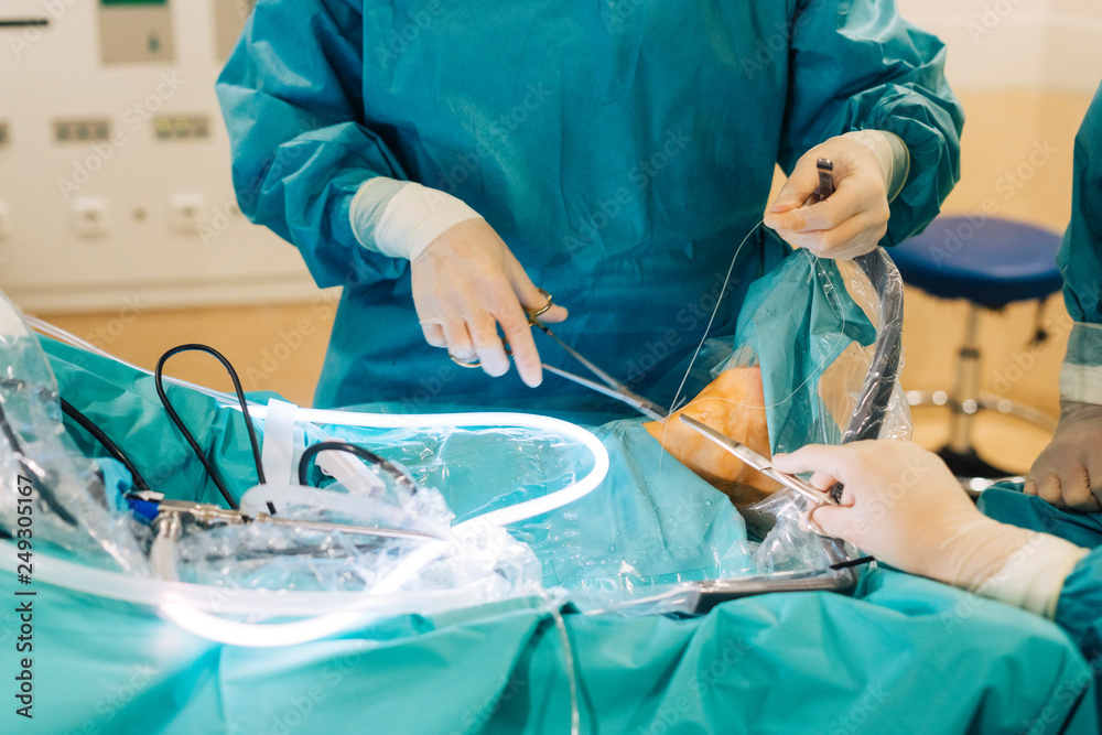 Team of surgeons operating in the hospital Team of surgeons operating in the hospital