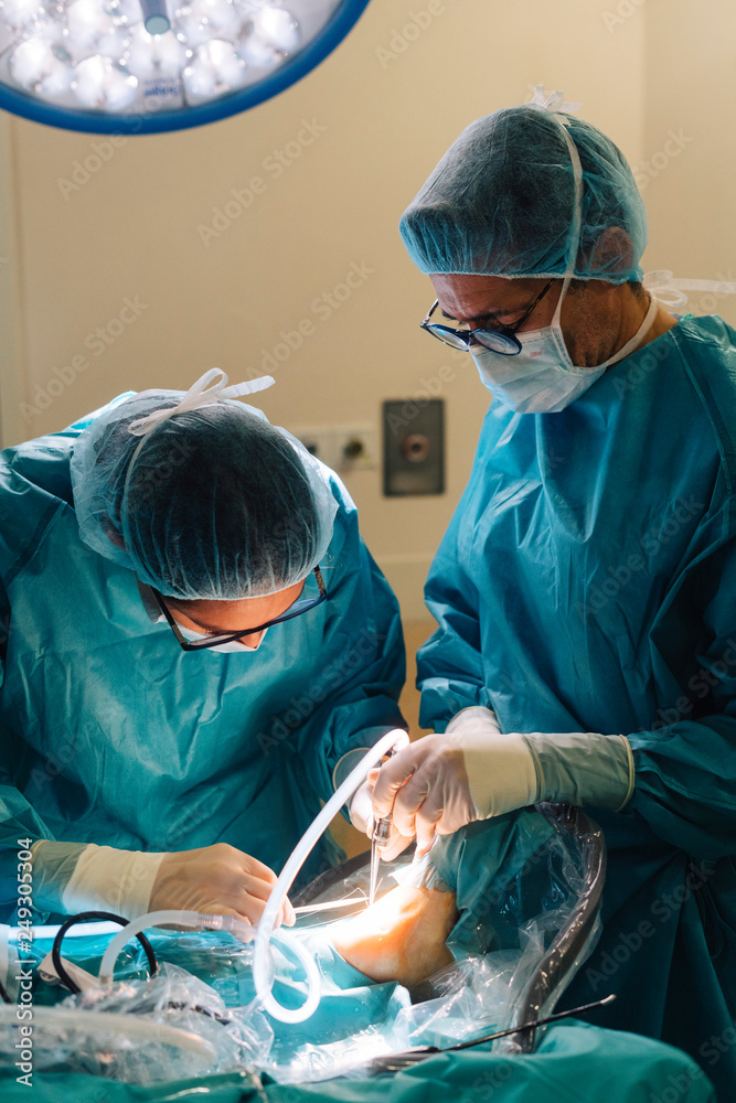 Team of surgeons operating in the hospital Team of surgeons operating in the hospital