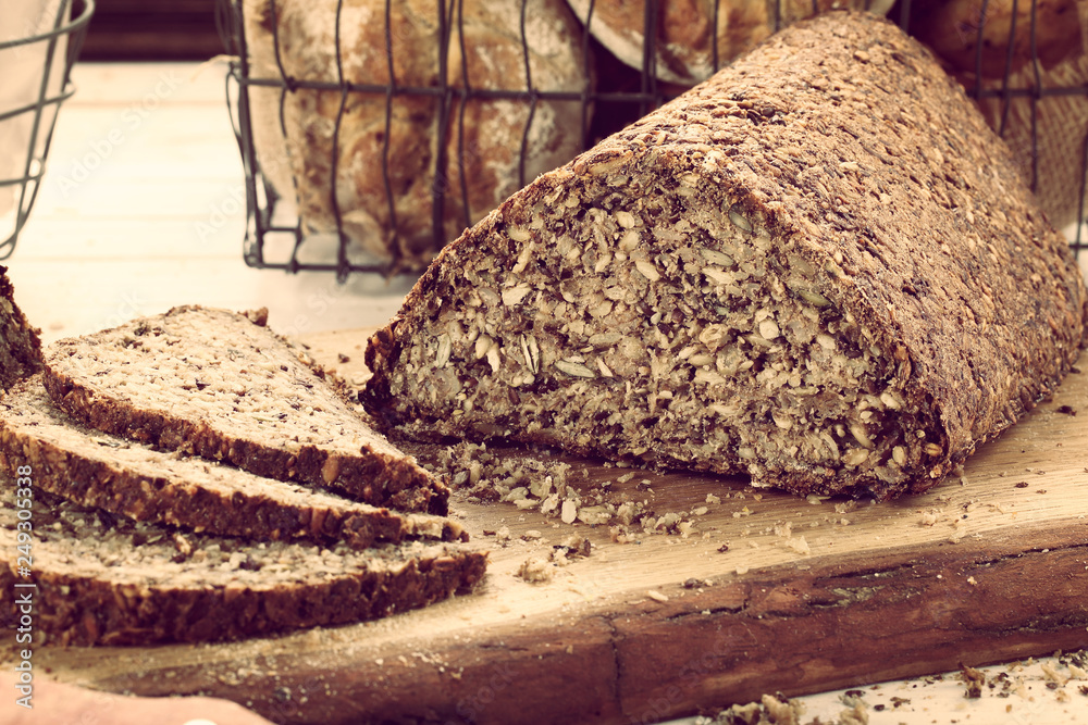 Fresh bread slice and cutting on rustic wooden table Fresh bread slice and cutting on rustic wooden table