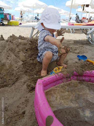 child playing with sand