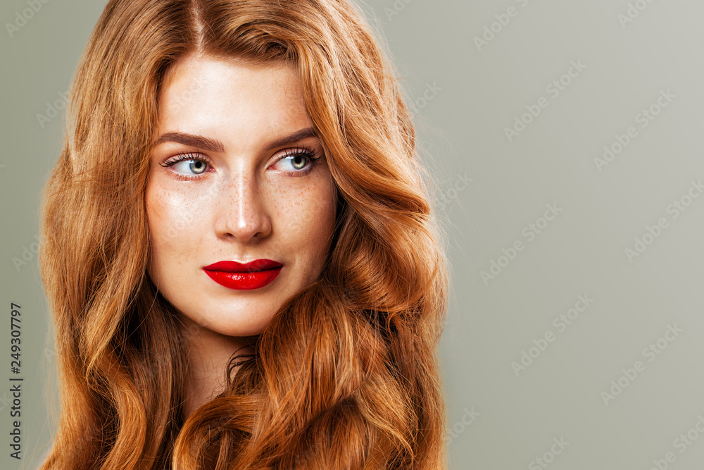 with freckles and ginger hair. Natural redhead girl, beautiful female model face closeup Stock-foto | Adobe Stock
