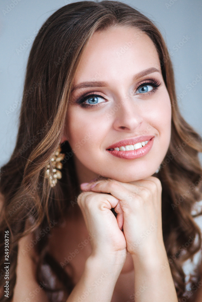Beauty close-up portrait of bride with luxury make-up and hairstyle, studio indoor photo. Beauty close-up portrait of bride with luxury make-up and hairstyle, studio indoor photo.