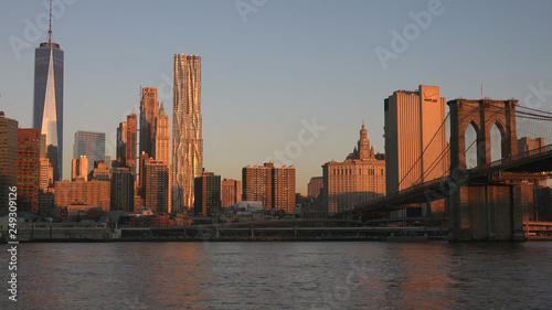Brooklyn Bridge and Manhattan at the sunset New York City