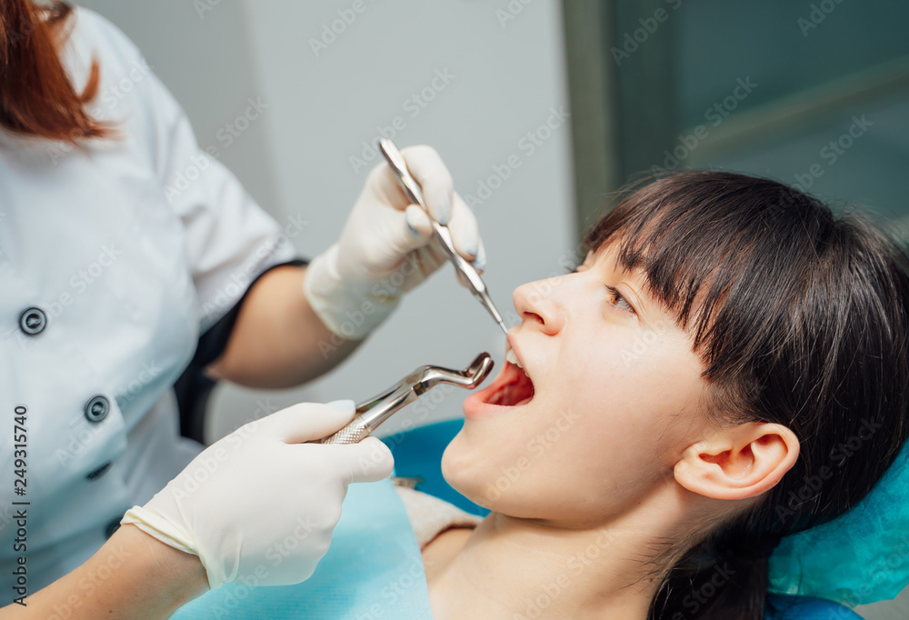 Woman having teeth examined at dentists. Dental clinic Woman having teeth examined at dentists. Dental clinic