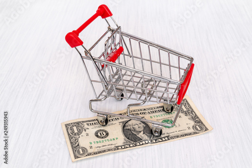 Shopping cart and one dollar