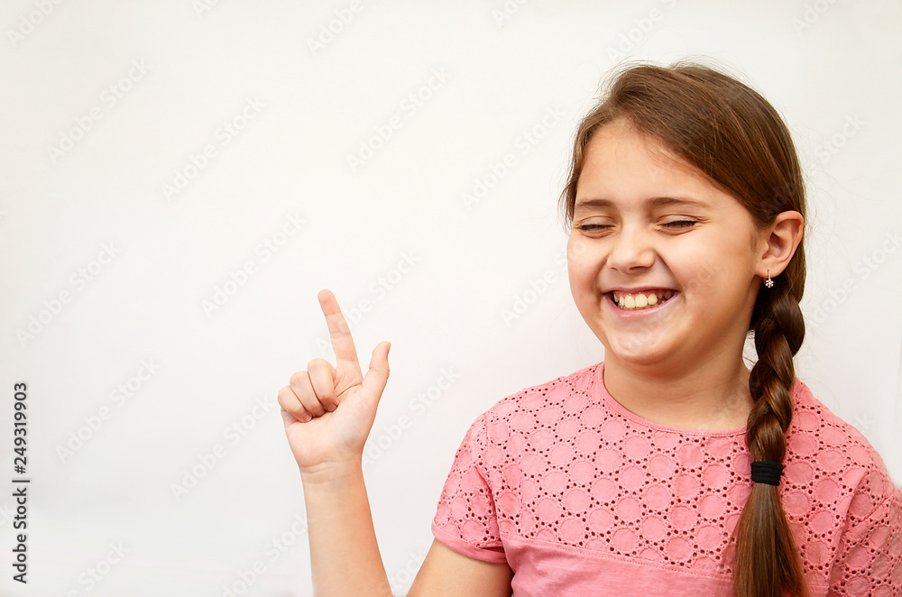 girl in a pink blouse on a white background, shows different emotions and gestures girl in a pink blouse on a white background, shows different emotions and gestures