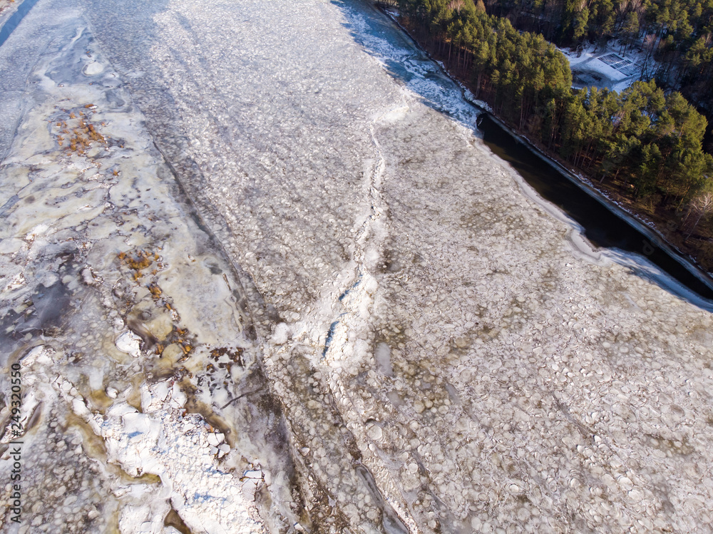 Aerial view of frozen river. Aerial view of ice. Aerial shot of river in winter. Aerial view of frozen river. Aerial view of ice. Aerial shot of river in winter.