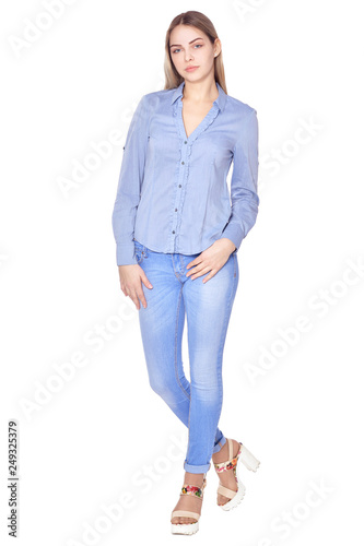 Portrait of beautiful woman in blue jeans posing isolate