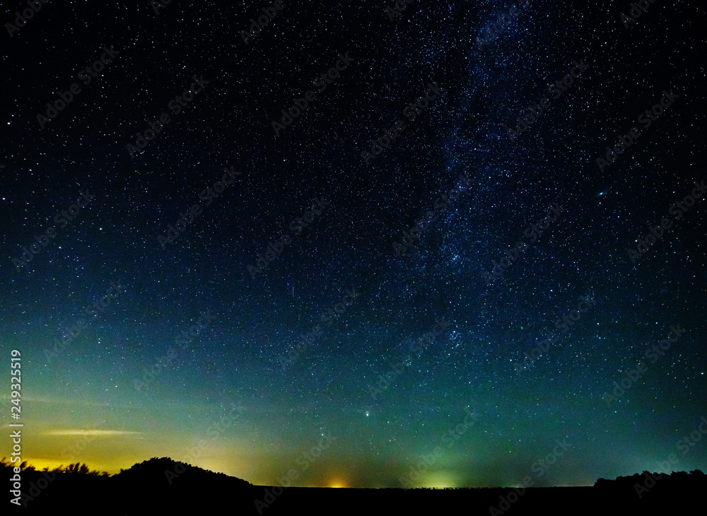 Starry sky and the milky way over the water.Bright star Mars. Starry sky and the milky way over the water.Bright star Mars.