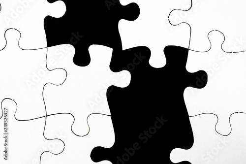 Macro shot of a jigsaw puzzle in black and white.